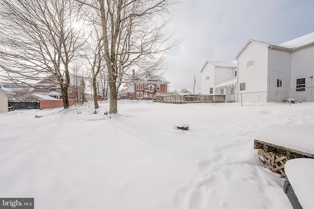 view of yard covered in snow