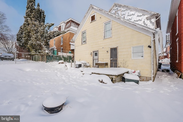 view of snow covered house