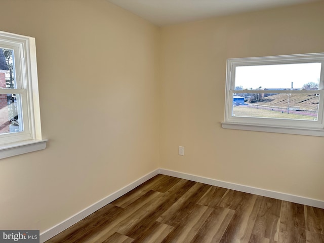 empty room with wood-type flooring