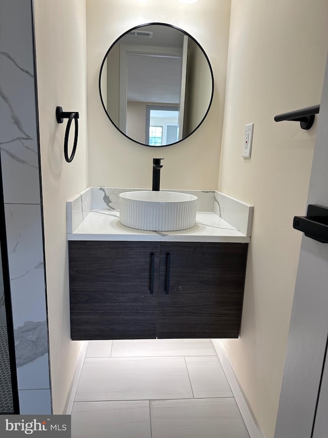 bathroom featuring vanity and tile patterned flooring