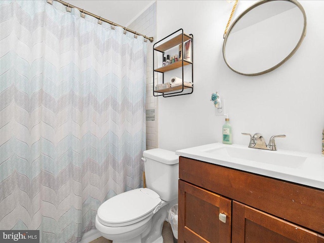 bathroom with toilet and vanity