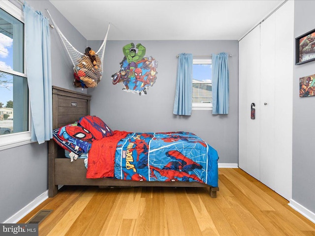 bedroom with light hardwood / wood-style floors