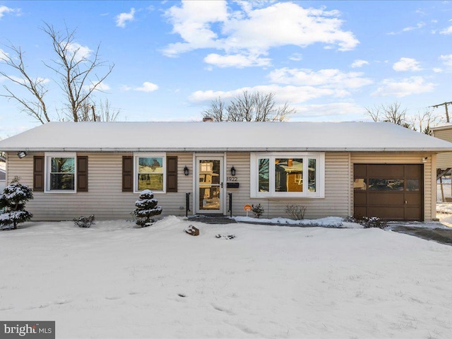 ranch-style house featuring a garage