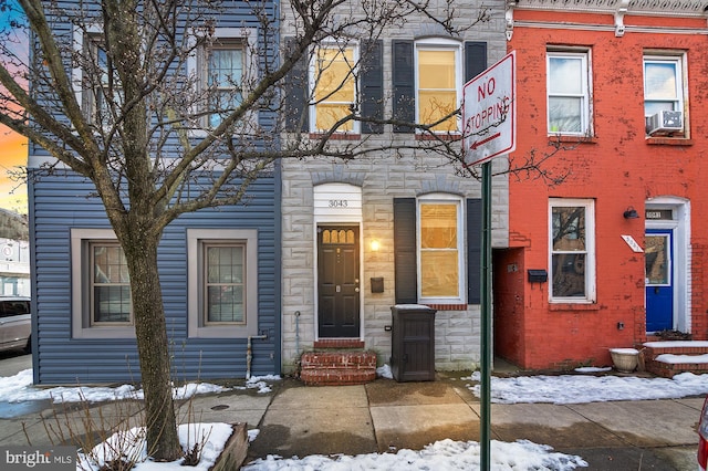 view of front of property with cooling unit