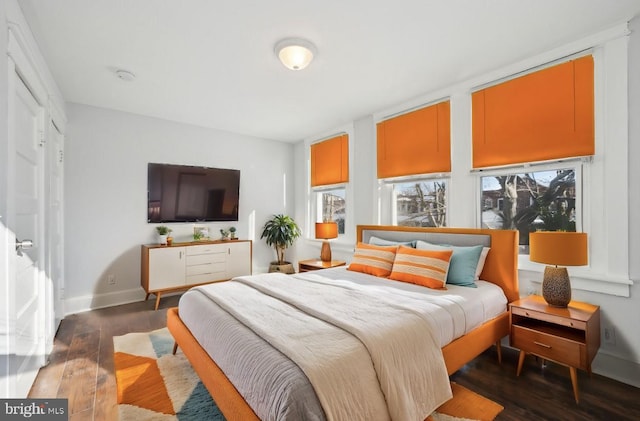 bedroom featuring dark hardwood / wood-style flooring