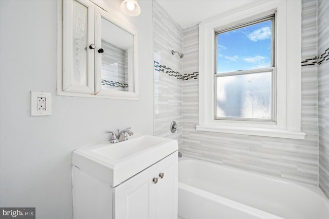 bathroom with a bath and vanity