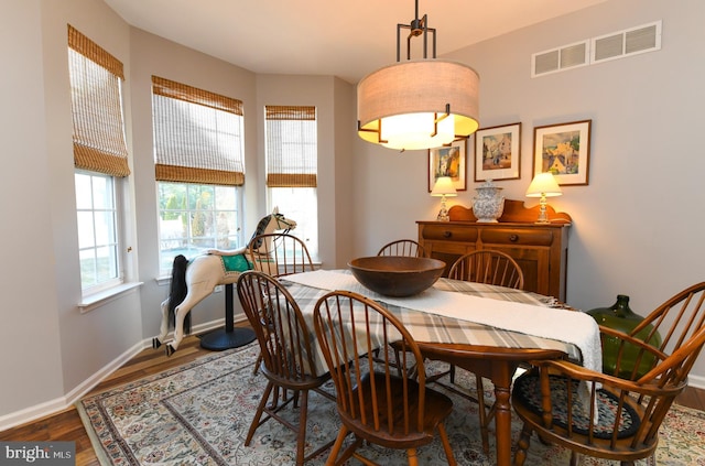 dining area with hardwood / wood-style floors