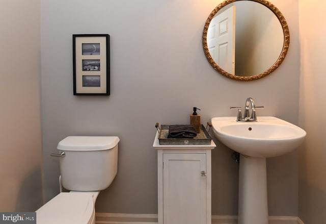 bathroom with toilet and sink