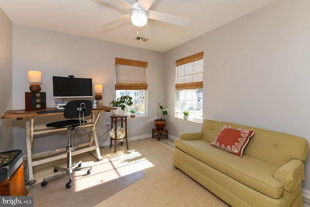 carpeted office with ceiling fan