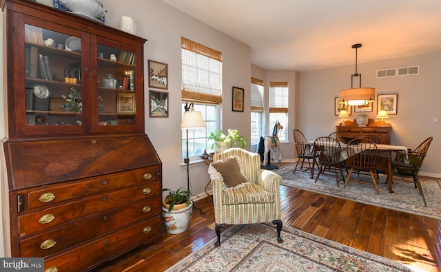 sitting room featuring dark hardwood / wood-style floors