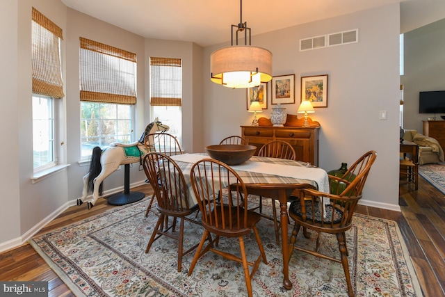 dining space featuring dark hardwood / wood-style floors