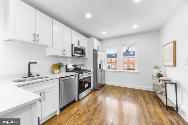 kitchen featuring white cabinets, sink, and stainless steel appliances