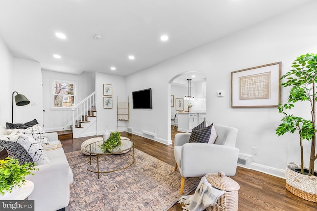 living room with dark wood-type flooring