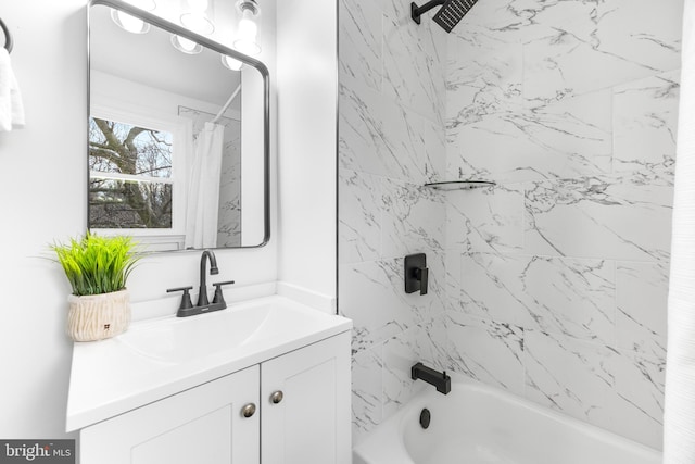 bathroom with shower / bathtub combination with curtain and vanity