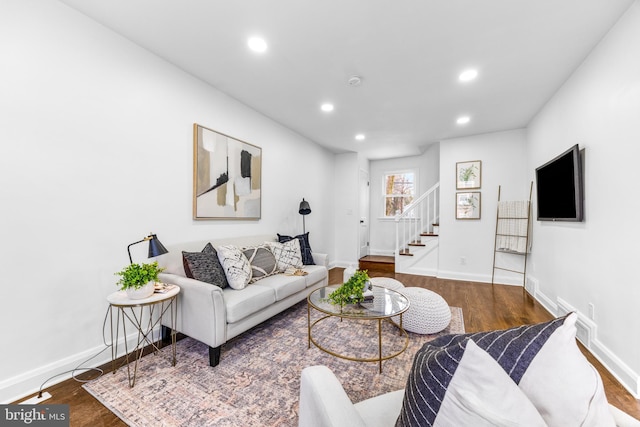 living room featuring dark wood-type flooring