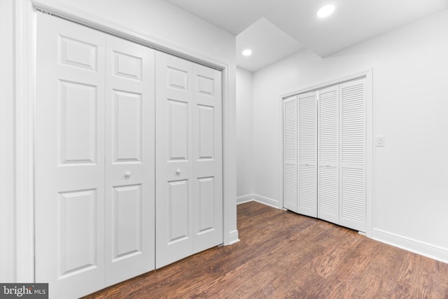 unfurnished bedroom featuring dark hardwood / wood-style floors