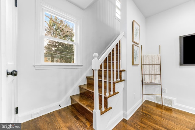 stairs with hardwood / wood-style floors