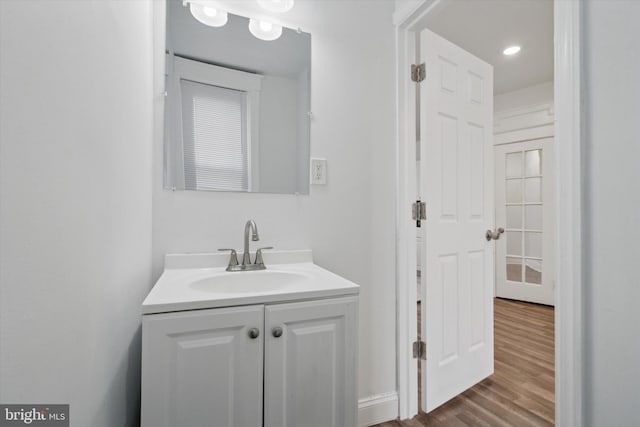 bathroom with vanity and hardwood / wood-style floors