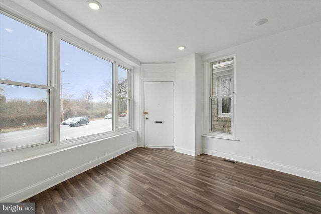 unfurnished room featuring dark hardwood / wood-style floors