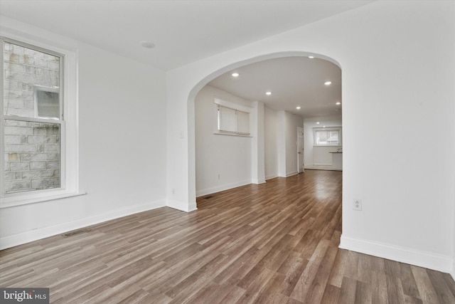 spare room with wood-type flooring