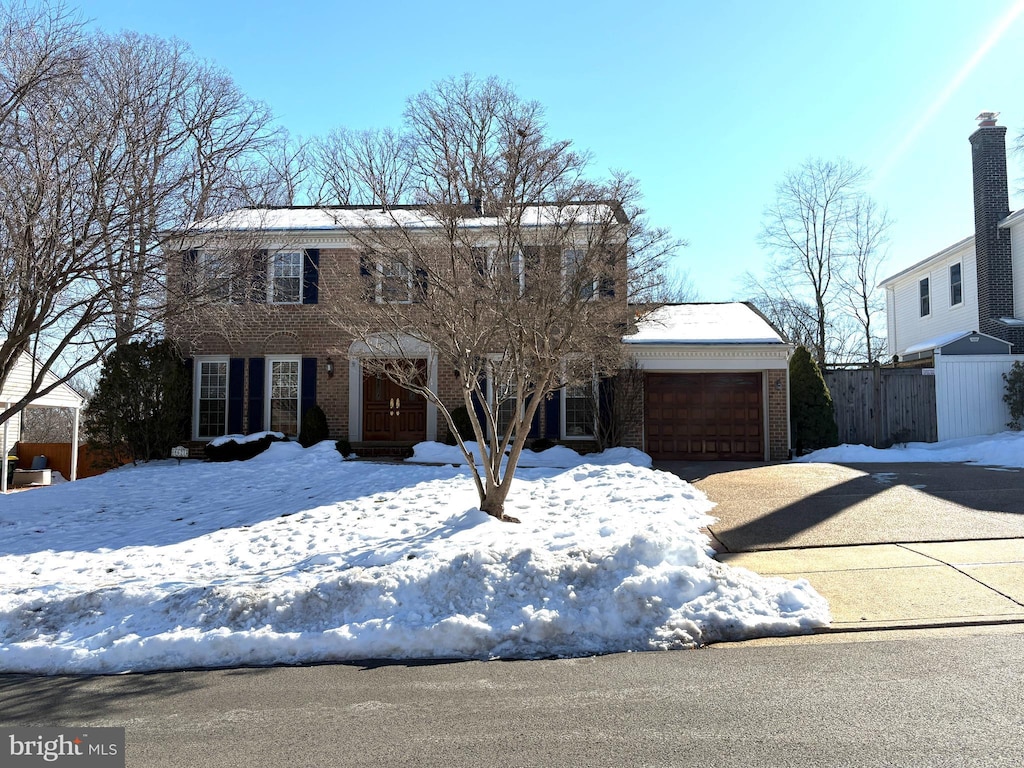 colonial home with a garage