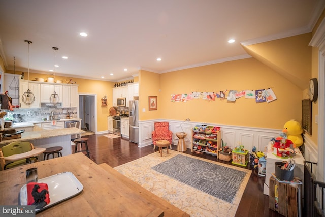 interior space featuring sink, crown molding, and dark hardwood / wood-style floors