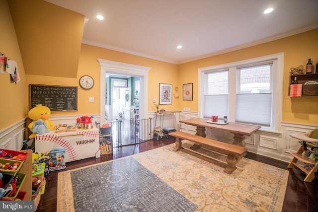 recreation room with crown molding and dark hardwood / wood-style flooring