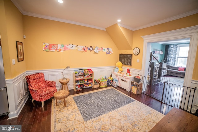 rec room with ornamental molding and dark hardwood / wood-style flooring