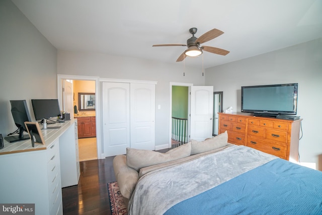 bedroom with ceiling fan, dark wood-type flooring, a closet, and ensuite bath