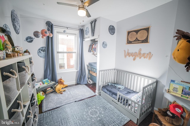 bedroom with wood-type flooring and ceiling fan