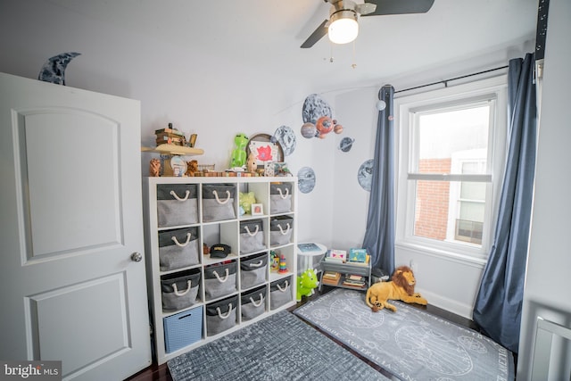 playroom featuring ceiling fan and plenty of natural light