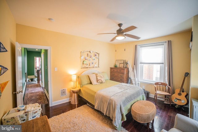 bedroom featuring ceiling fan and dark hardwood / wood-style floors