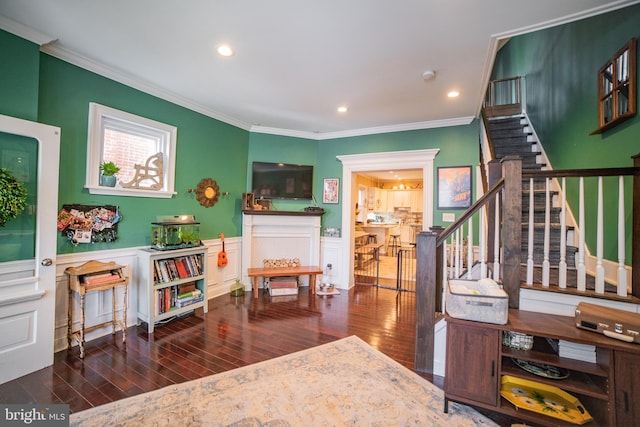 interior space with dark hardwood / wood-style flooring and ornamental molding