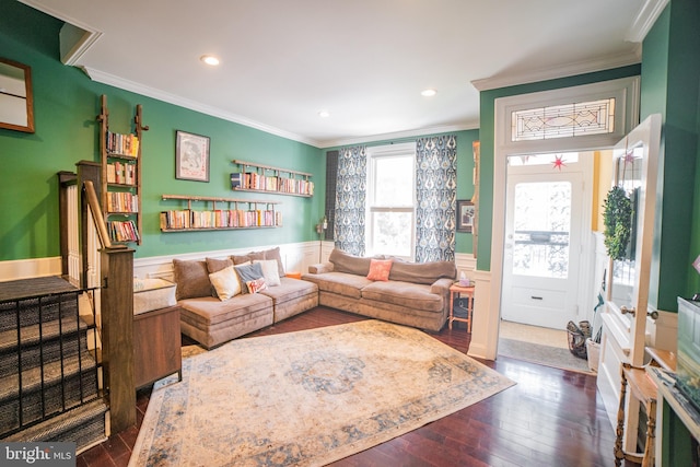 living room featuring dark hardwood / wood-style flooring and ornamental molding