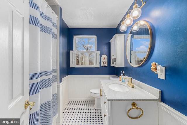 bathroom featuring toilet and vanity