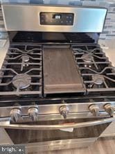 details featuring stainless steel range with gas stovetop