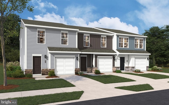 view of front of property featuring a garage and a front lawn