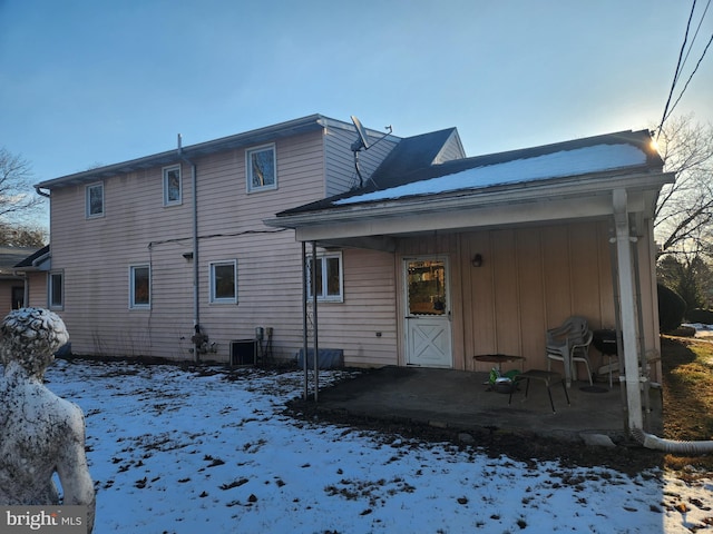 view of snow covered house