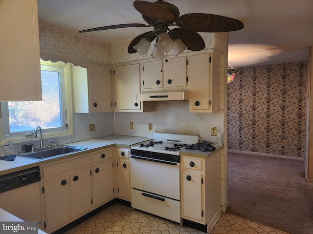 kitchen featuring ceiling fan, white appliances, sink, and cream cabinets