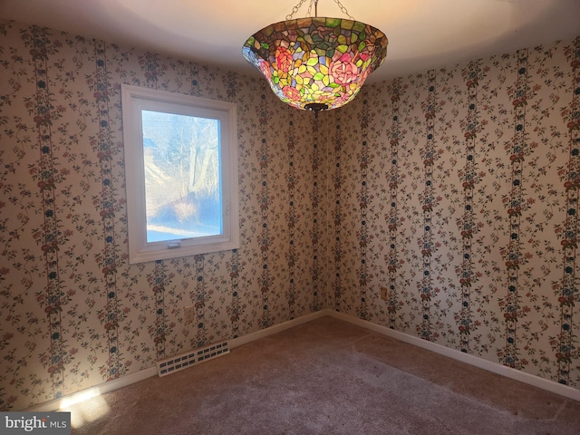 unfurnished dining area featuring carpet flooring