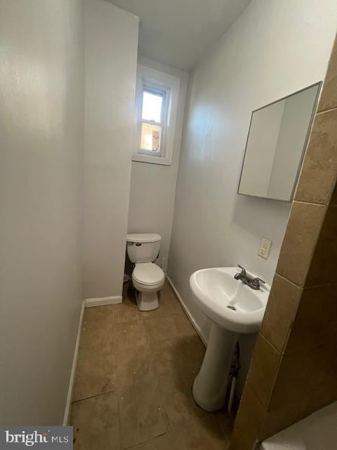 bathroom with sink and toilet