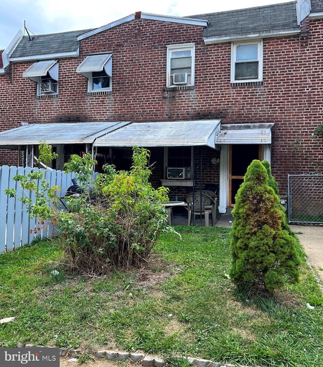 rear view of house with cooling unit