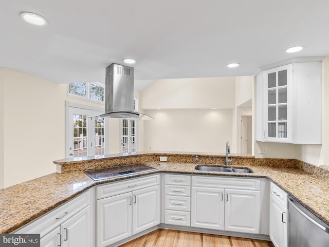 kitchen featuring sink, white cabinets, dishwasher, cooktop, and island range hood