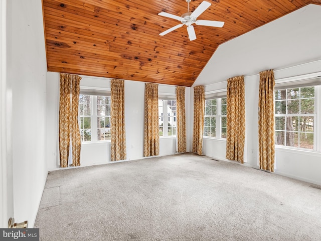 unfurnished living room featuring a healthy amount of sunlight, wood ceiling, lofted ceiling, and carpet floors