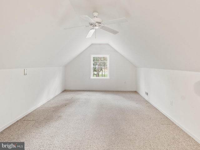 bonus room featuring vaulted ceiling, light carpet, and ceiling fan