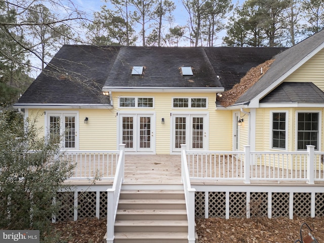 rear view of house featuring a deck