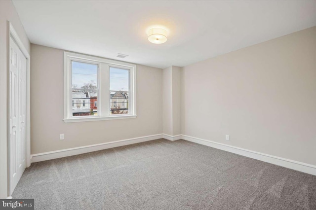 unfurnished bedroom with carpet floors and a closet