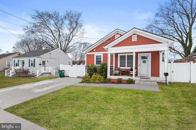 bungalow featuring a porch and a front yard