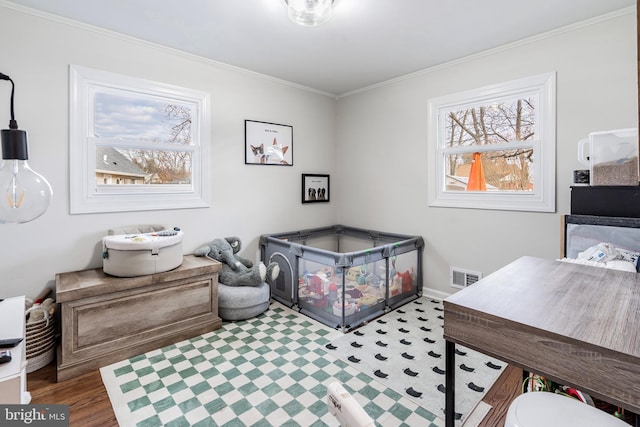 interior space featuring hardwood / wood-style floors and ornamental molding