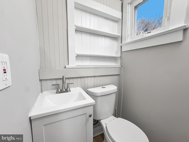 bathroom with vanity and toilet